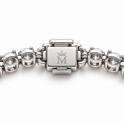 Dew Garland clasp underside with official crowned-M engraving and open-backed round diamond settings