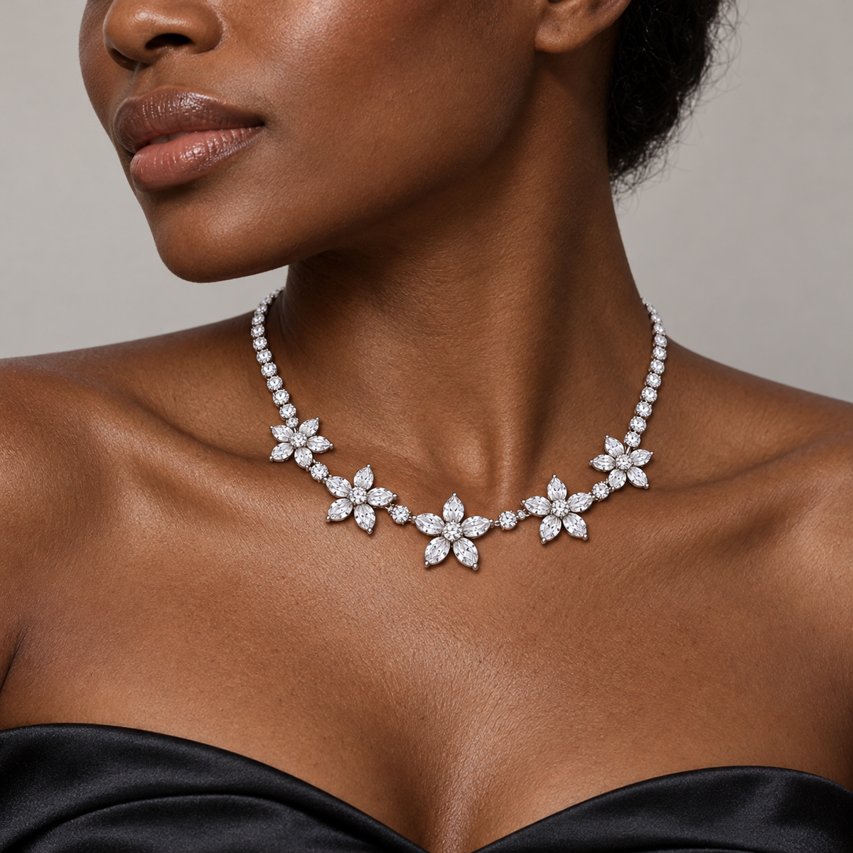 Adult model with deep skin wearing the Five Petals floral diamond necklace