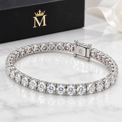 Evermore round diamond tennis bracelet in 14K white gold, right three-quarter product view on white.