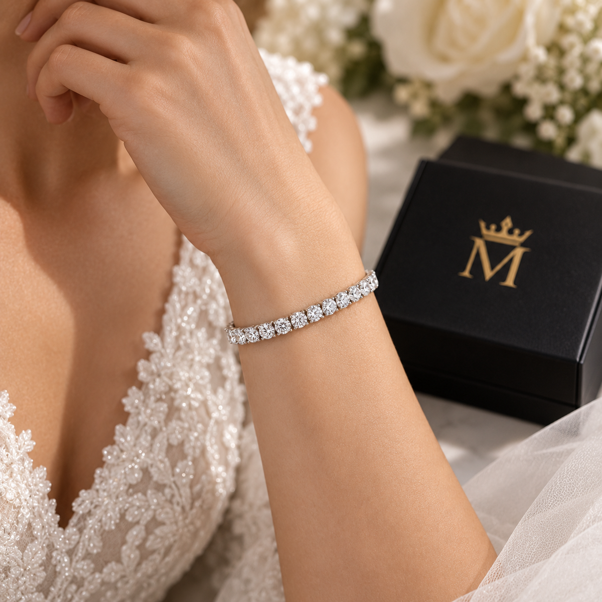 Evermore round diamond tennis bracelet in 14K white gold, worn by a model.