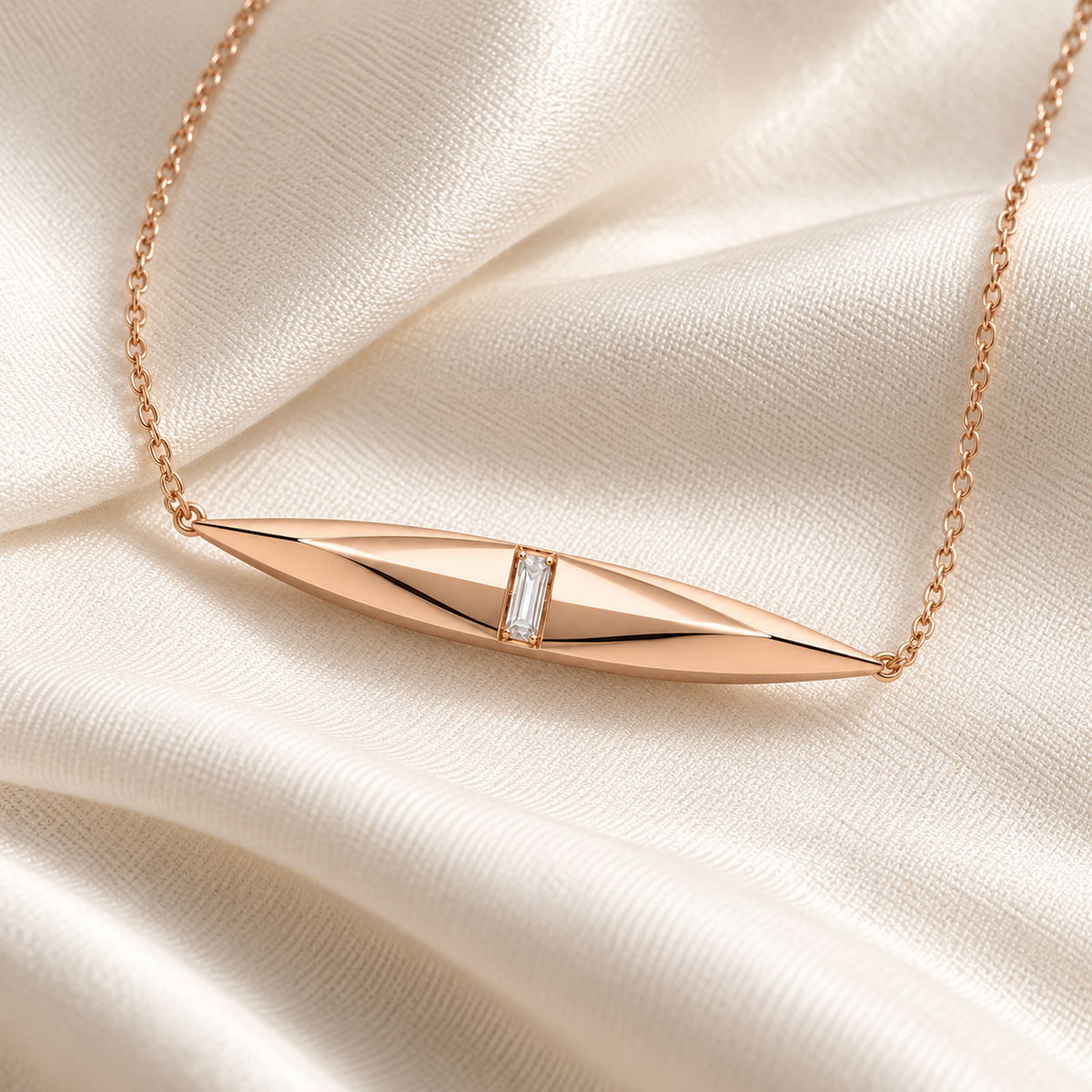 MISSISSI FACET LINE design visualization in rose gold, with the faceted spindle pendant and fine chain styled on fabric.
