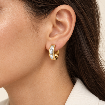 MISSISSI Facet 14K yellow gold huggie with three baguette lab-grown diamonds, shown on an adult model; AI-generated wearing visualization