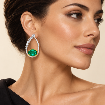 MISSISSI Verdant Orbit GE26-E03 on an adult model; AI-generated illustrative styling visualization, not a customer photograph or exact scale reference. Graduated white diamond open oval frame with a horizontal green oval emerald inside its lower opening.