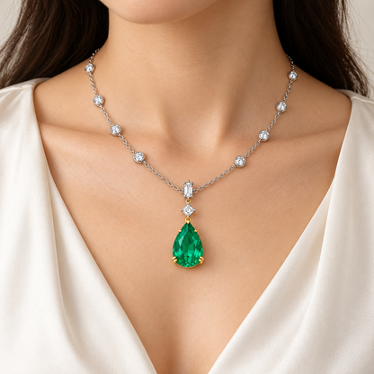 MISSISSI GE26-N03 emerald necklace worn with a cream blouse. Design visualization.