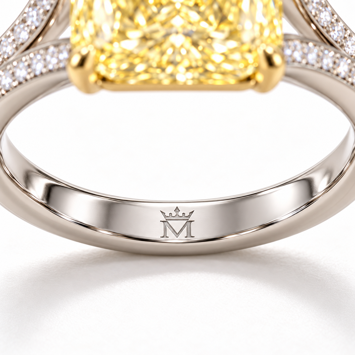 AI design preview of Golden Interval yellow radiant ring, single crowned-M engraving at inner center lower shank