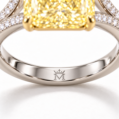 AI design preview of Golden Interval yellow radiant ring, single crowned-M engraving at inner center lower shank