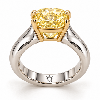 AI design preview of Golden Mantle yellow elongated cushion ring, single inner-center crowned-M engraving