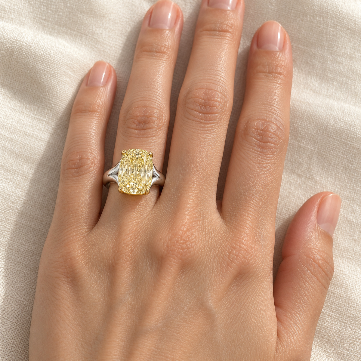 AI design preview of Golden Mantle yellow elongated cushion ring, adult left ring-finger wearing view; scale illustrative