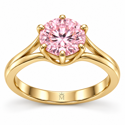 MISSISSI Blush Bloom pink round brilliant lab-grown diamond ring with six claws and open yellow-gold arch shoulders, inner-band detail with tiny crown-M engraving