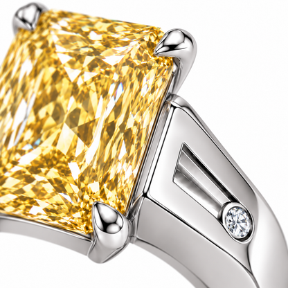 Solar Channel yellow radiant lab-grown diamond ring in white metal, slotted shoulder and round diamond accent detail