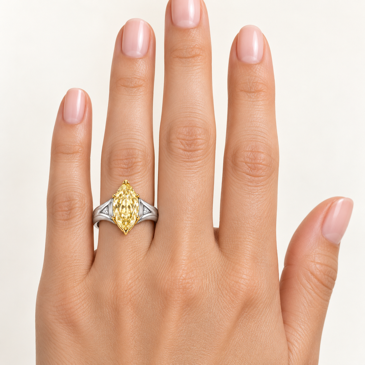 Aureate Wings yellow marquise lab-grown diamond ring, worn on the left ring finger