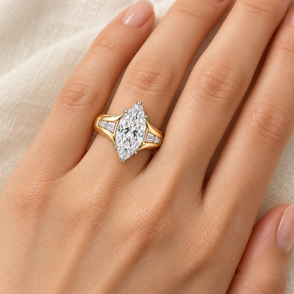 AI design preview of LUMEN yellow-gold marquise ring worn on an adult ring finger; scale is illustrative