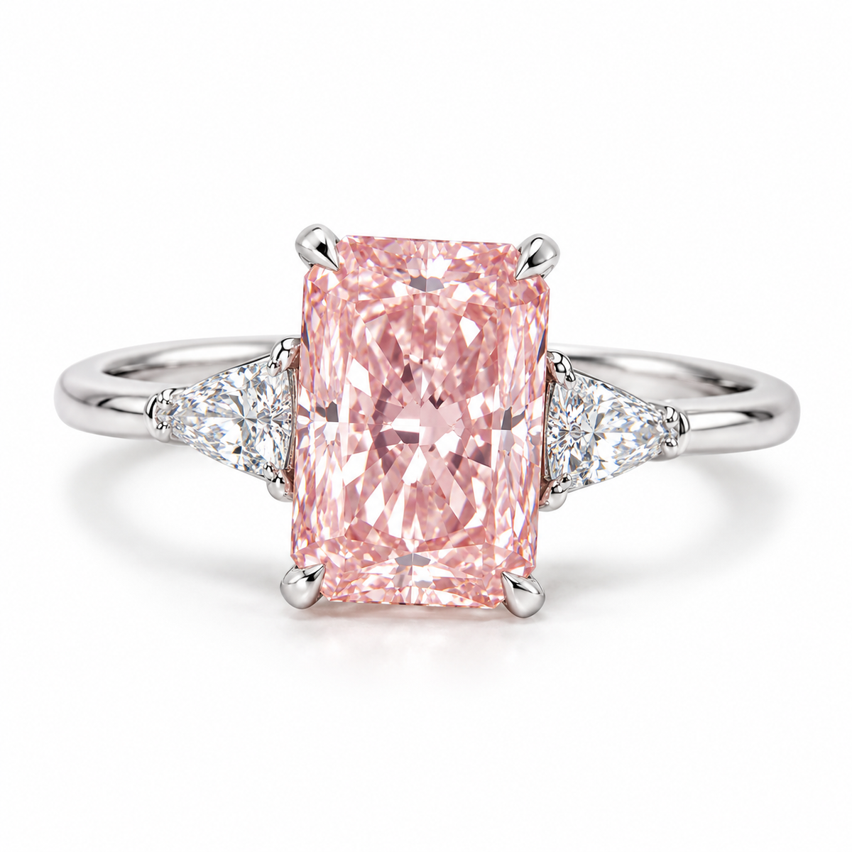 Front design preview of an elongated rectangular pink lab-grown center and triangular white side accents in white gold.