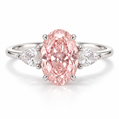 Front AI design preview of an elongated oval pink lab-grown diamond ring with two outward-pointing pear-shaped white side stones in white-gold appearance.