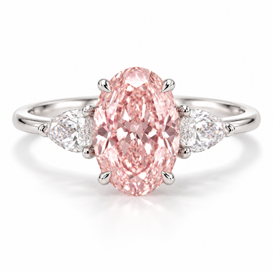 Front AI design preview of an elongated oval pink lab-grown diamond ring with two outward-pointing pear-shaped white side stones in white-gold appearance.