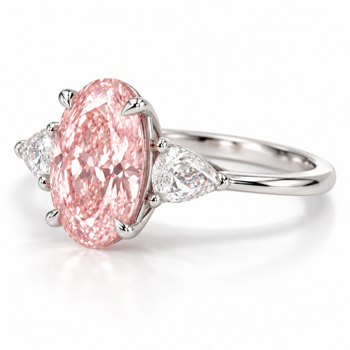Opposite low oblique AI view of the oval pink-center ring showing the right pear-shaped side stone, four center claws and slim shank.