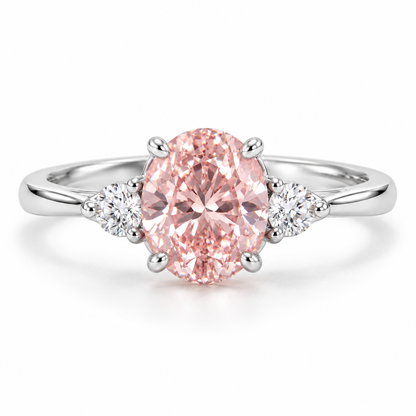 Front AI design preview of a soft oval pink lab-grown diamond ring with two small round white side stones in white-gold appearance.