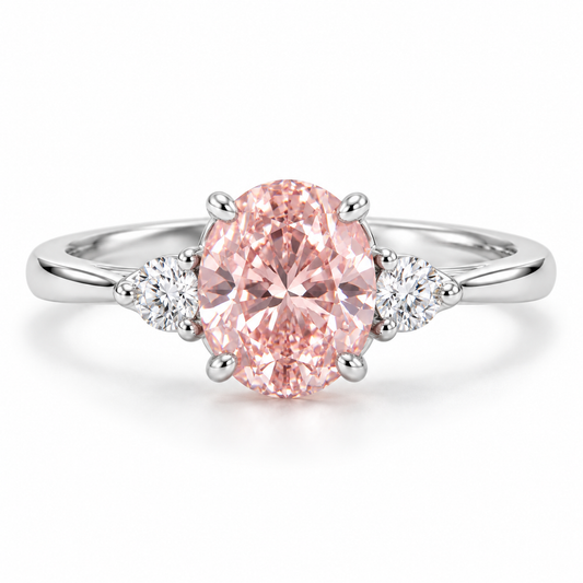 Front AI design preview of a soft oval pink lab-grown diamond ring with two small round white side stones in white-gold appearance.