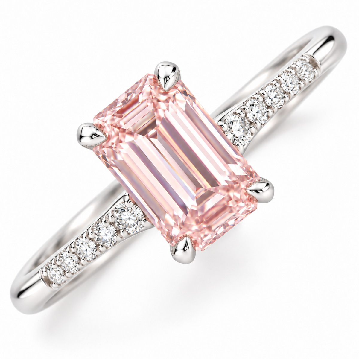 Diagonal close-up AI view of the pink emerald-cut center and fine diamond-set shoulders.