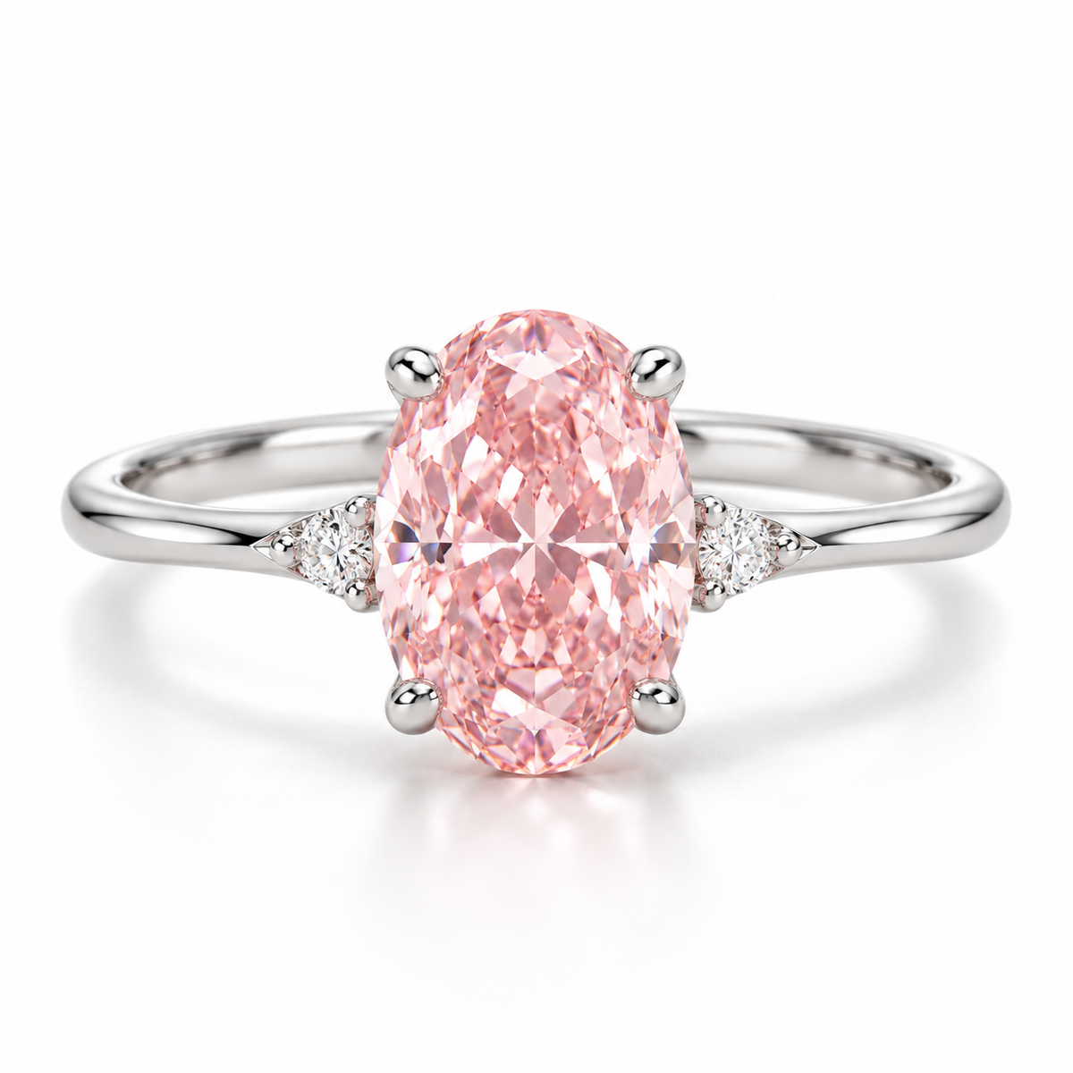 AI front design view of an oval pink lab-grown center with small white shoulder accents and a slender white-gold band.