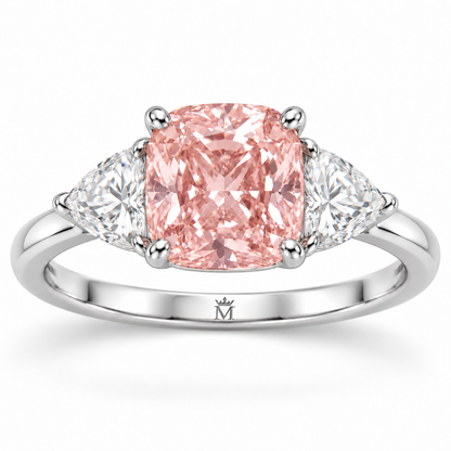 AI design visualization of Rosehaven with a pink cushion lab-grown center, triangular white side stones and a discreet crowned-M engraving inside the white-gold shank.