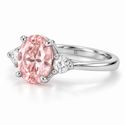 AI design visualization: Roselle soft oval pink lab-grown diamond ring, opposite low angle with discreet crowned-M engraving inside the lower shank.