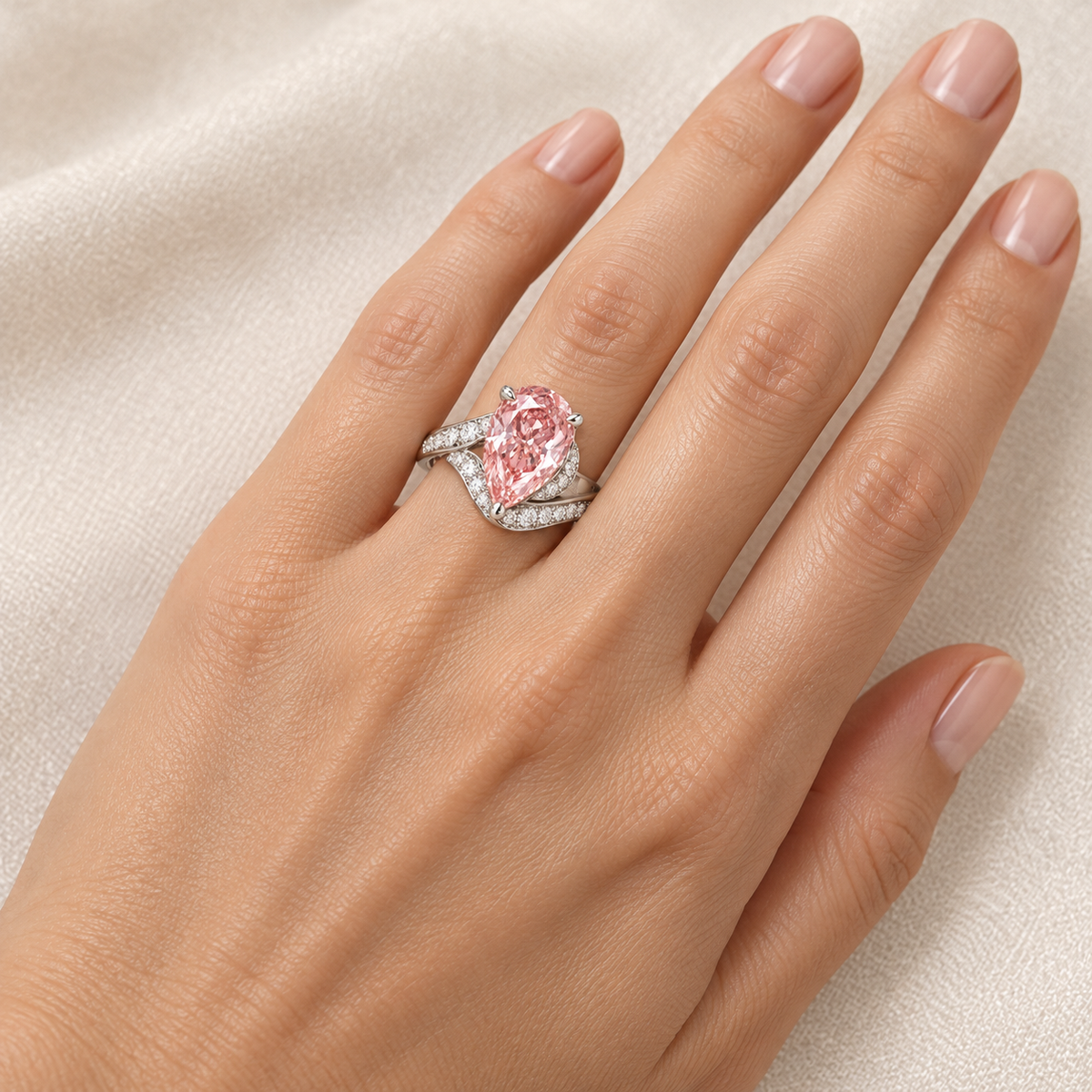 MISSISSI Rosetide pink pear lab-grown diamond bypass ring in white gold worn on the left ring finger. Design visualization.