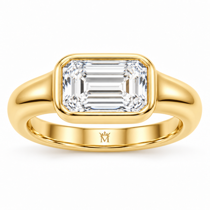 Serein east-west emerald-cut bezel engagement ring in 14K yellow gold, front product view on white.