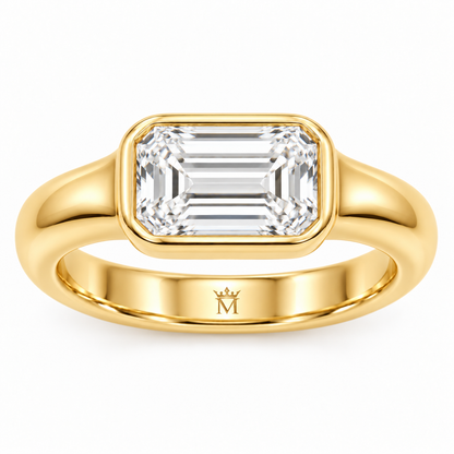 Serein east-west emerald-cut bezel engagement ring in 14K yellow gold, top-down product view on white.