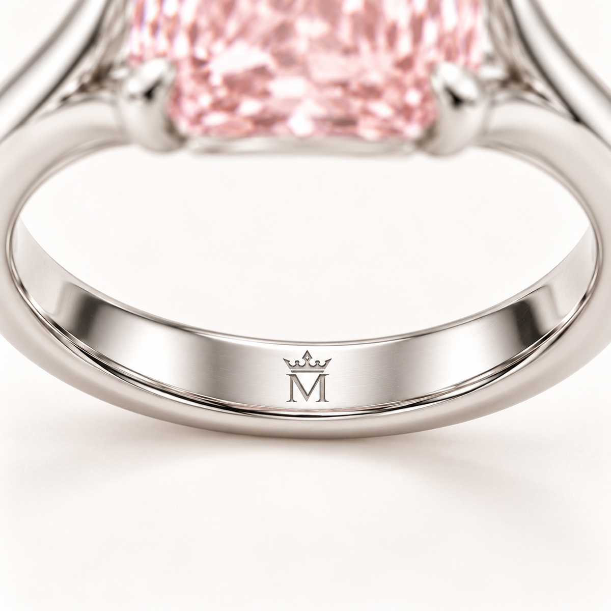 AI design preview close-up of Silk Frame single crowned-M physical engraving at inside center of lower shank