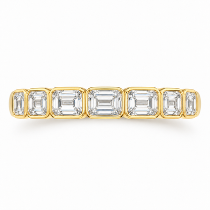 Solace east-west emerald-cut half-eternity wedding band in 14K yellow gold, top-down product view on white.