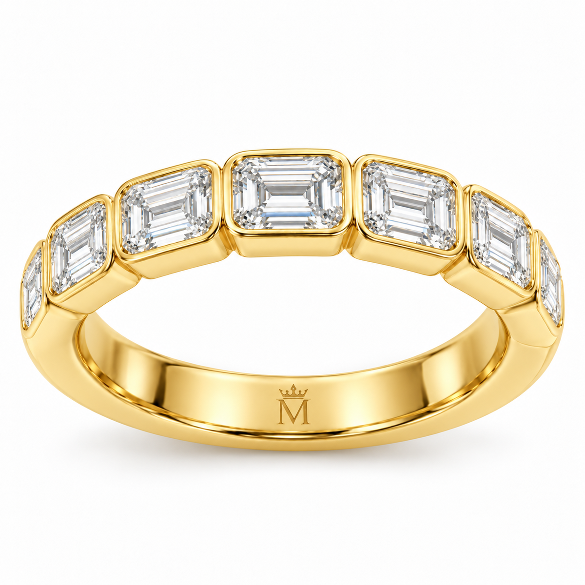 Solace east-west emerald-cut half-eternity wedding band in 14K yellow gold, interior crowned-M hallmark detail.