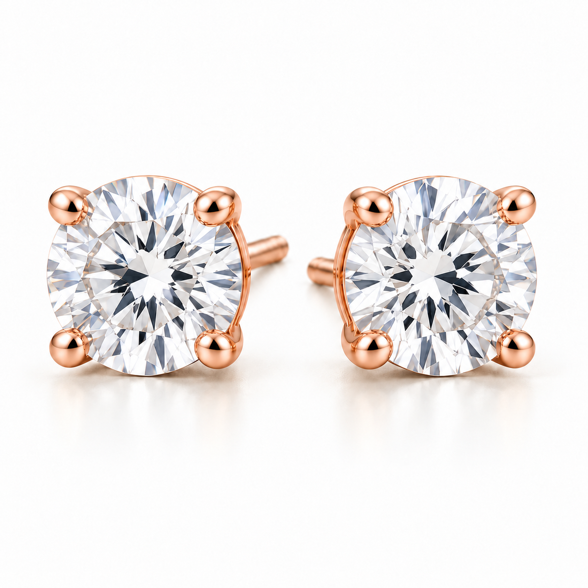 T13 round four-prong lab-grown diamond stud earrings in rose gold, matching pair on white background; design visualization