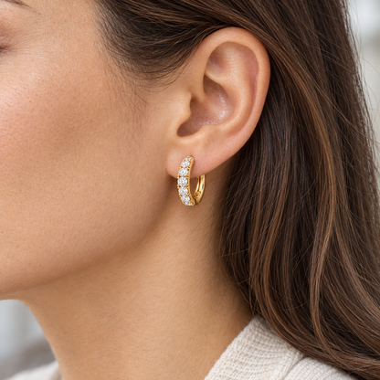 Round Lab-Grown Diamond Huggie Earrings 0.50 CTW in yellow gold, worn; design visualization