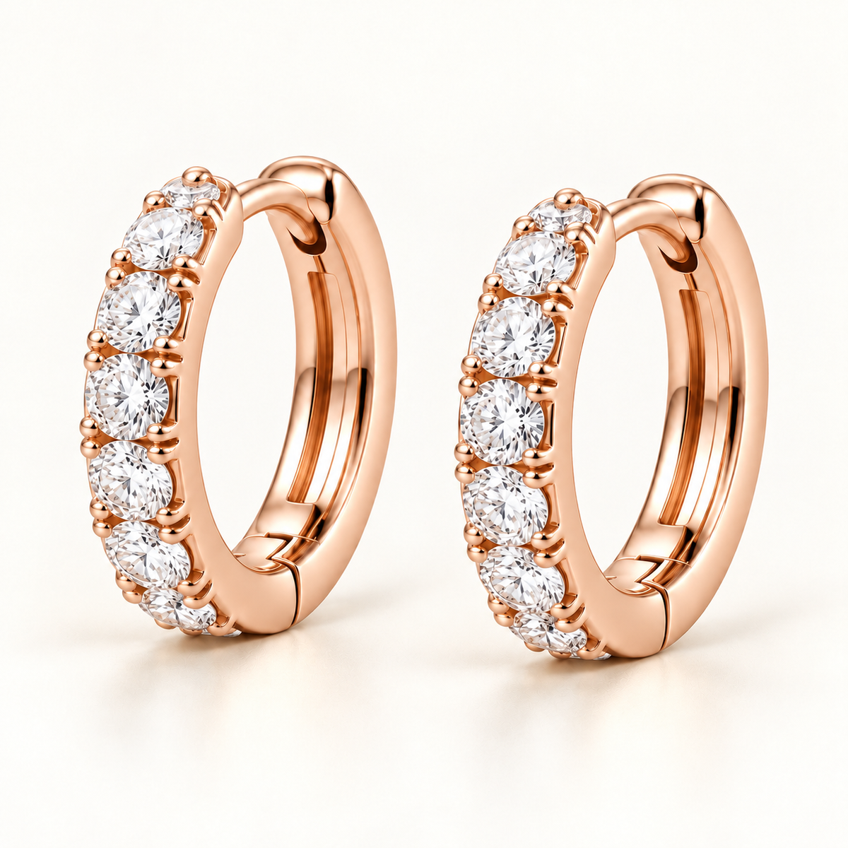 Round Lab-Grown Diamond Huggie Earrings 0.50 CTW in rose gold, oblique front; design visualization