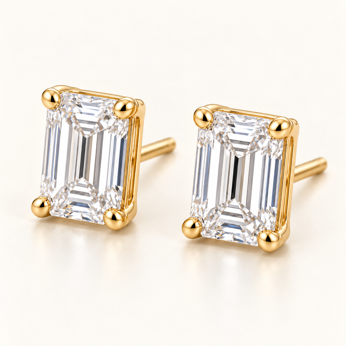 Emerald-Cut Lab-Grown Diamond Stud Earrings 2.00 CTW in yellow gold, oblique front; design visualization