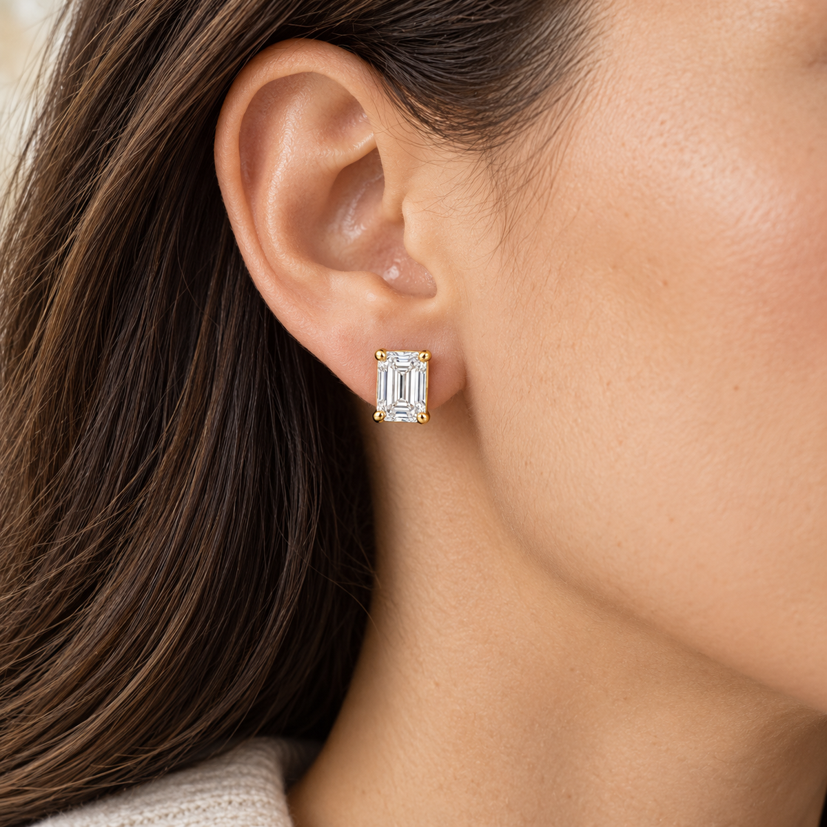Emerald-Cut Lab-Grown Diamond Stud Earrings 2.00 CTW in yellow gold, worn; design visualization