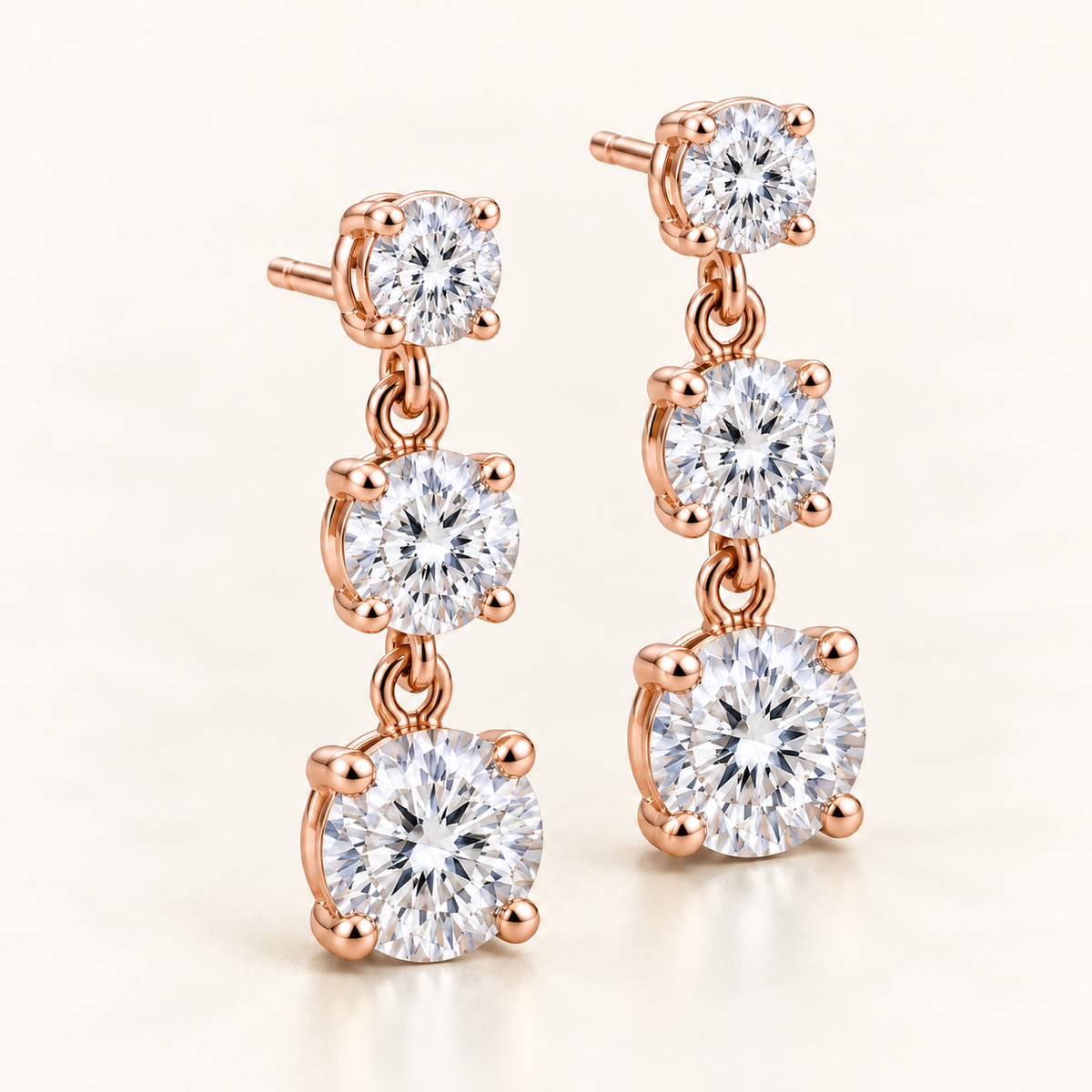 Graduated Three-Stone Lab-Grown Diamond Drop Earrings 3.00 CTW in rose gold, three quarter; design visualization