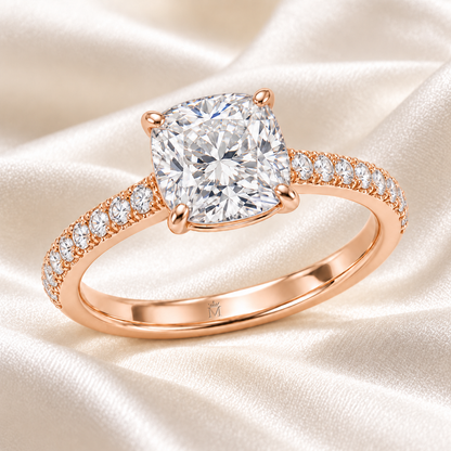MISSISSI cushion-cut lab-grown diamond ring with pavé shoulders in rose gold, styled on ivory silk