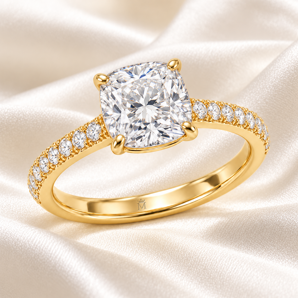 MISSISSI cushion-cut lab-grown diamond ring with pavé shoulders in yellow gold, styled on ivory silk