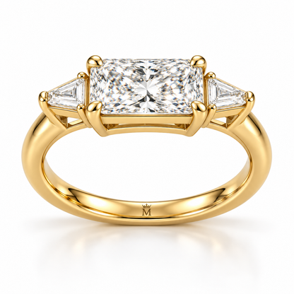 MISSISSI U03 east-west radiant lab-grown diamond three-stone ring in yellow gold, low view of the connected setting gallery; design visualization