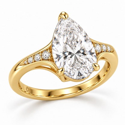MISSISSI U04 pear lab-grown diamond contour ring in yellow gold, angled view of the pear setting and diamond shoulders; design visualization