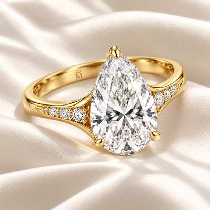 MISSISSI U04 pear lab-grown diamond contour ring in yellow gold, ring resting on ivory fabric; design visualization