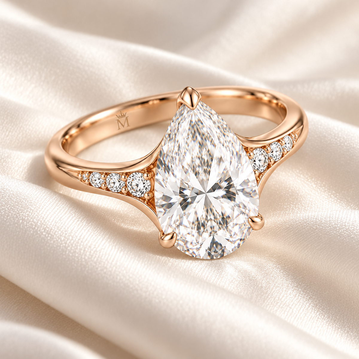 MISSISSI U04 pear lab-grown diamond contour ring in rose gold, ring resting on ivory fabric; design visualization