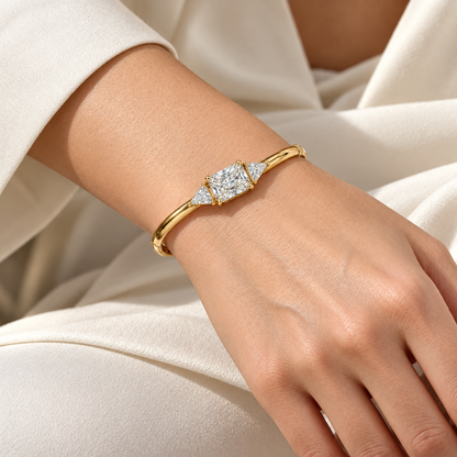 MISSISSI Radiant Triangle lab-grown diamond bangle in 14K yellow gold, worn
