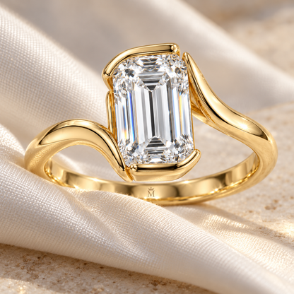 MISSISSI Emerald-Cut Bypass Lab-Grown Diamond Ring in yellow gold, editorial silk and stone still life; design visualization
