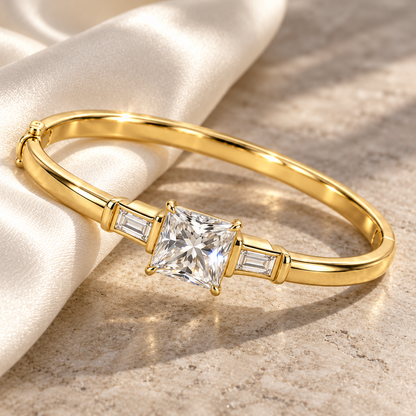 MISSISSI V09 princess-cut lab-grown diamond bangle in yellow gold, editorial still life on silk and stone; design visualization