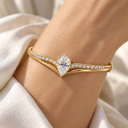 MISSISSI Pear V-Contour Lab-Grown Diamond Bangle in yellow gold, illustrative on-wrist view; design visualization