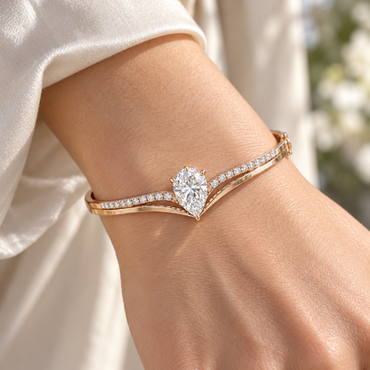 MISSISSI Pear V-Contour Lab-Grown Diamond Bangle in rose gold, illustrative on-wrist view; design visualization