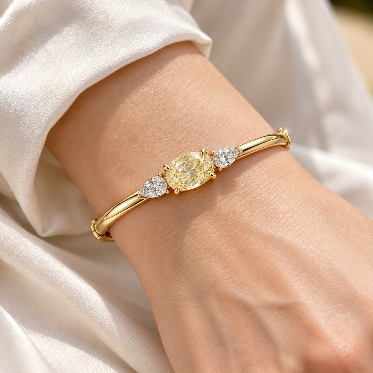 MISSISSI Yellow Oval Pear-Side Lab-Grown Diamond Bangle in yellow gold, illustrative on-wrist view; design visualization